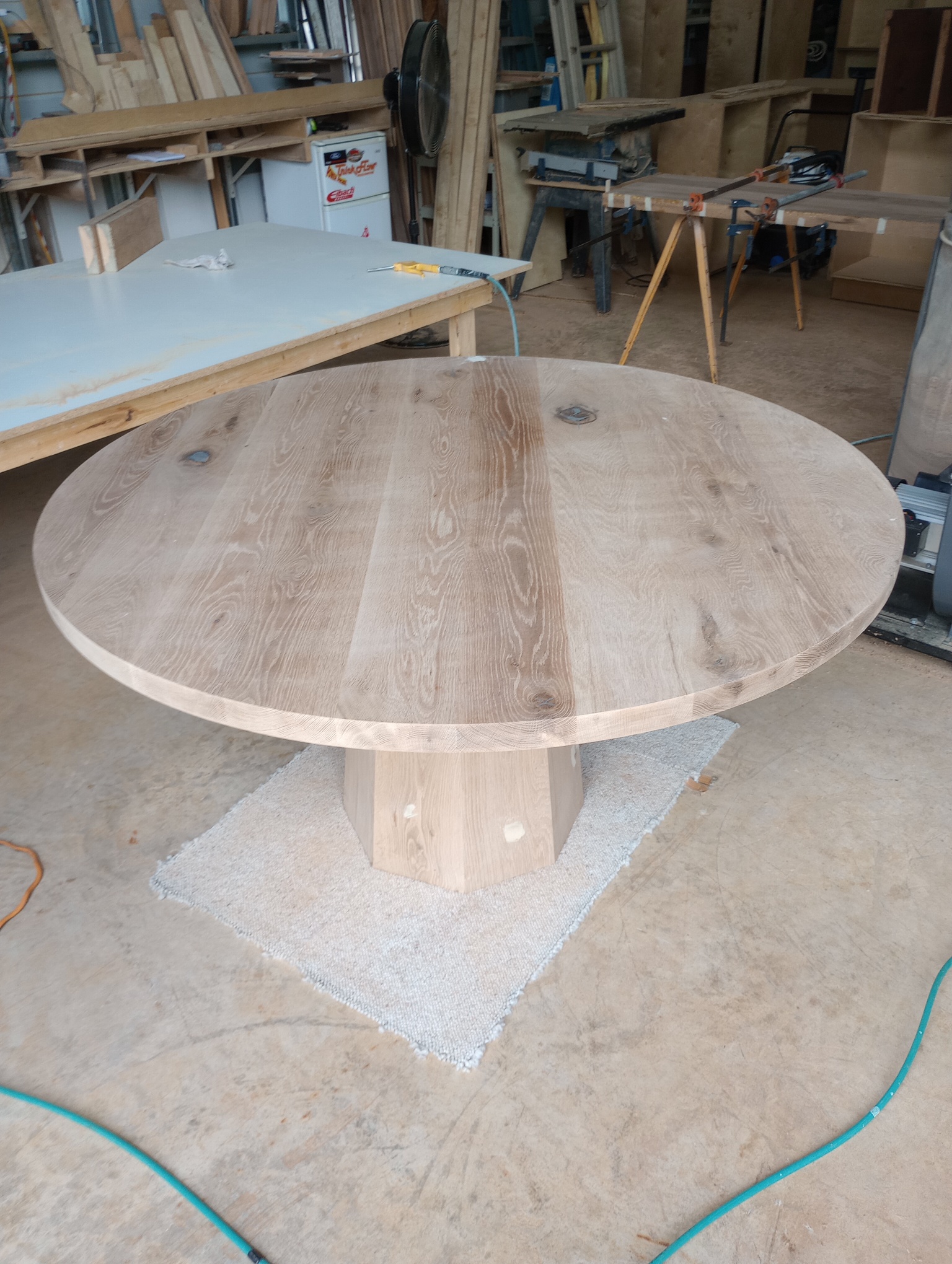 Round oak pedestal dining table