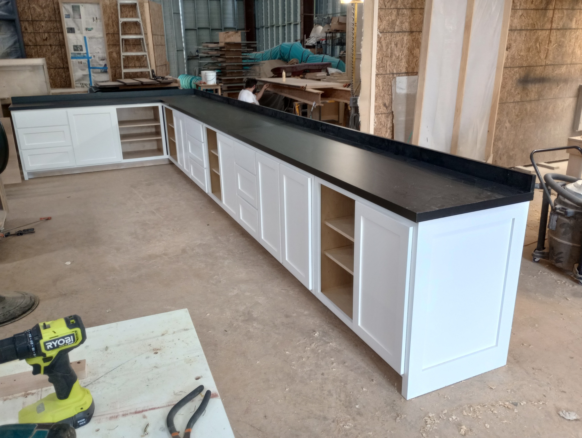 White kitchen cabinets with black countertop