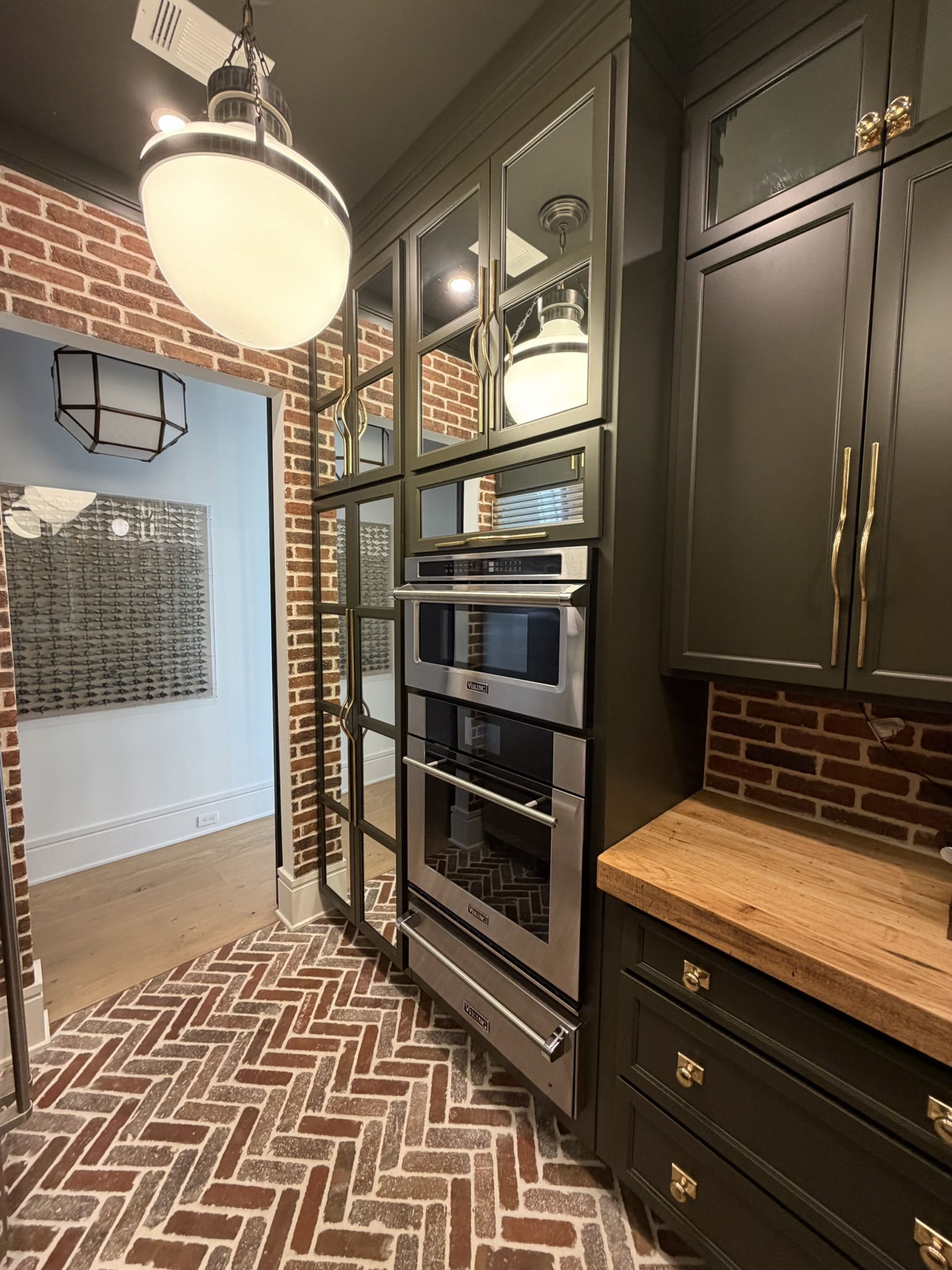 Dark green kitchen cabinetry