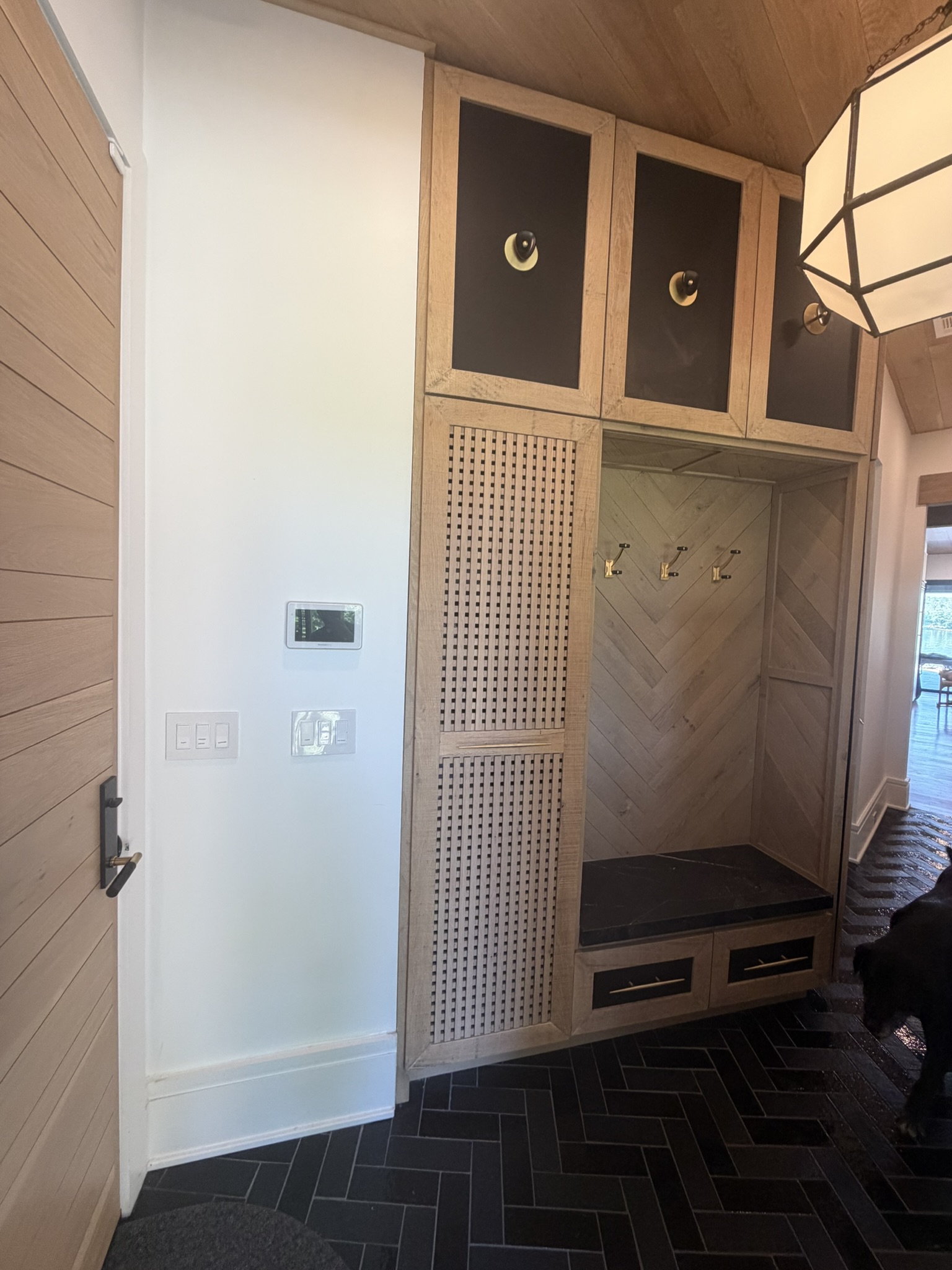 Custom entry hall drop zone built-in with herringbone back
